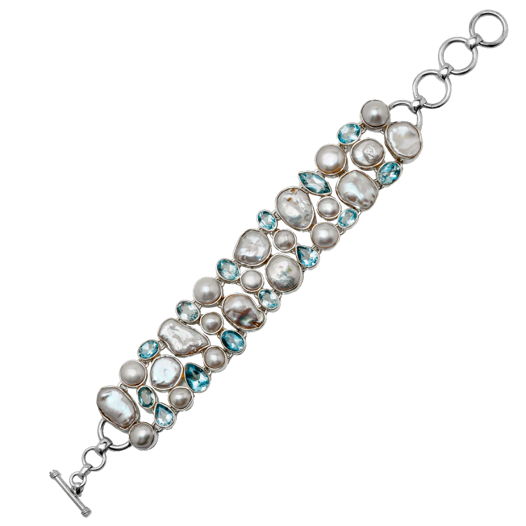 Широкий серебряный браслет с жемчугом и голубыми топазами